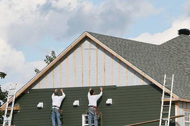 Professional Siding Contractor technician working in White Hall, WV